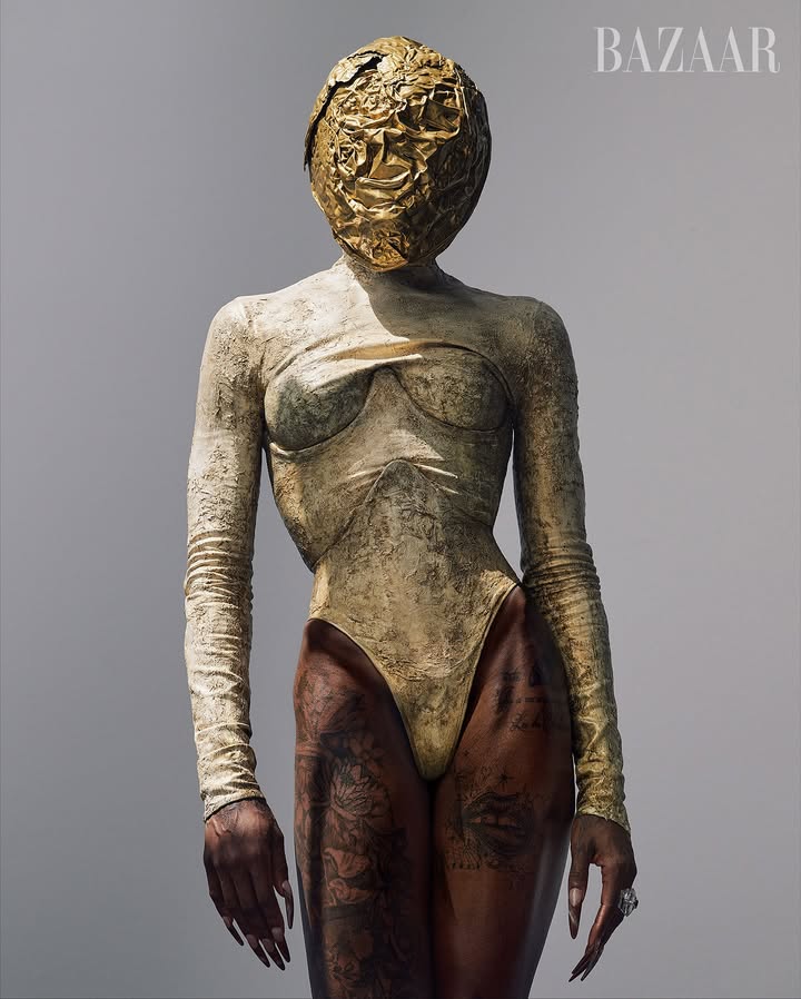 May be an image of sculpture, headdress and bust