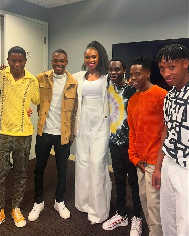 May be an image of one or more people, people standing and text