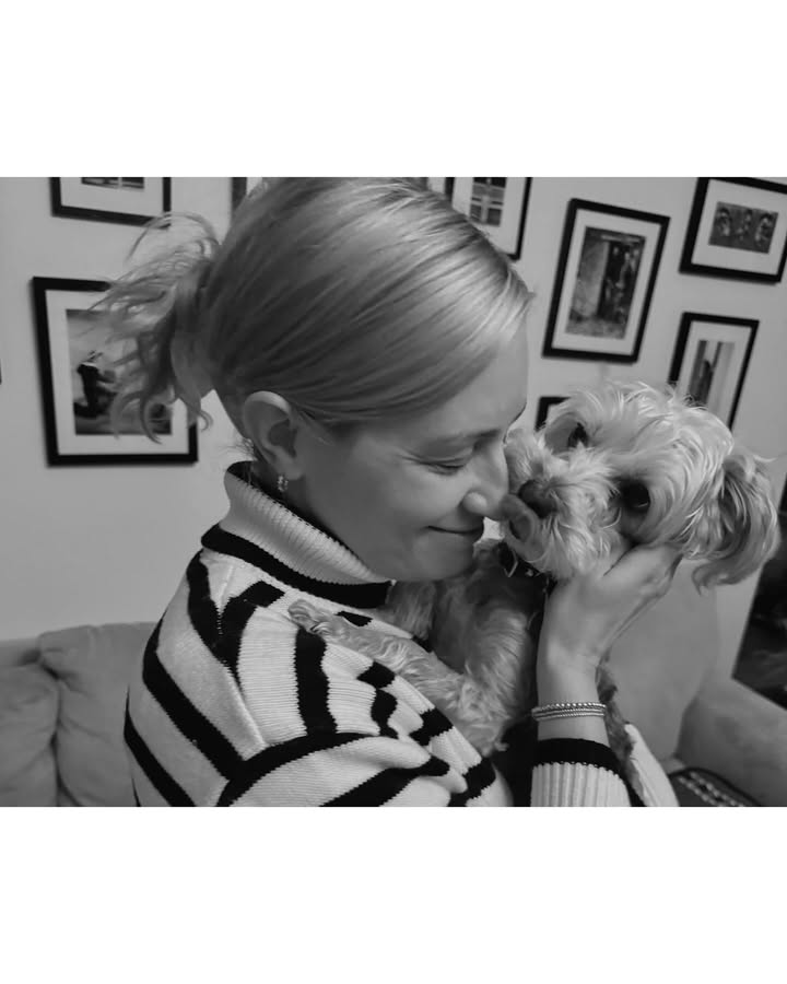 May be a black-and-white image of people kissing, Maltese, Norwich terrier and turtleneck