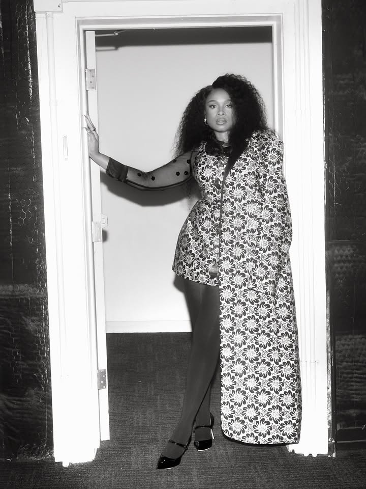 May be a black-and-white image of overcoat and bath robe