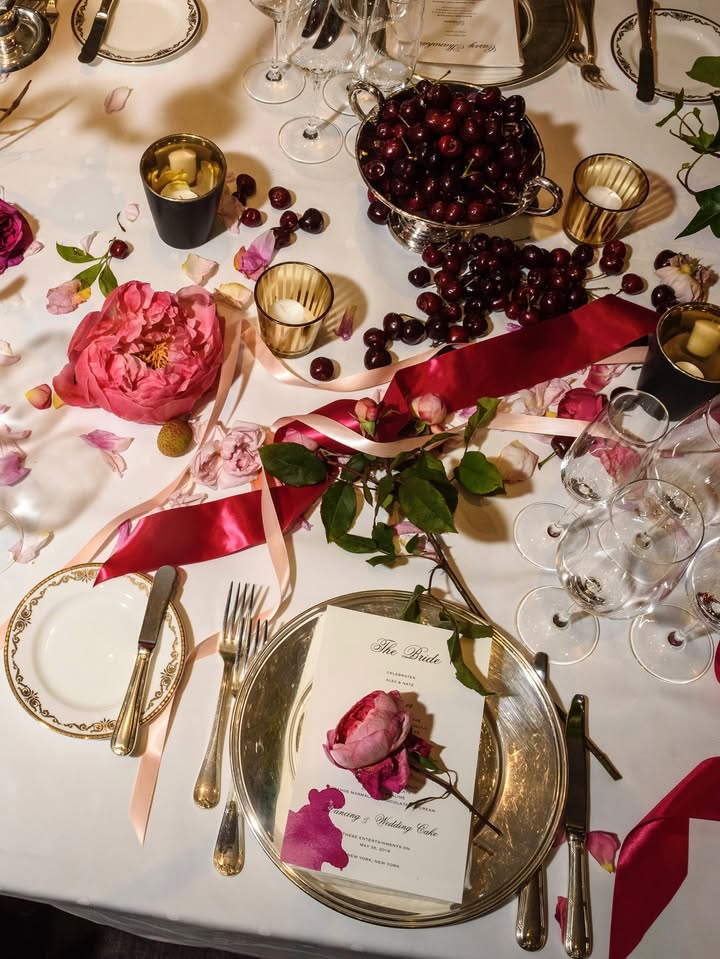 May be an image of napkin ring, candle holder, flower arrangement, tablecloth, fork, napkin, carnation and text