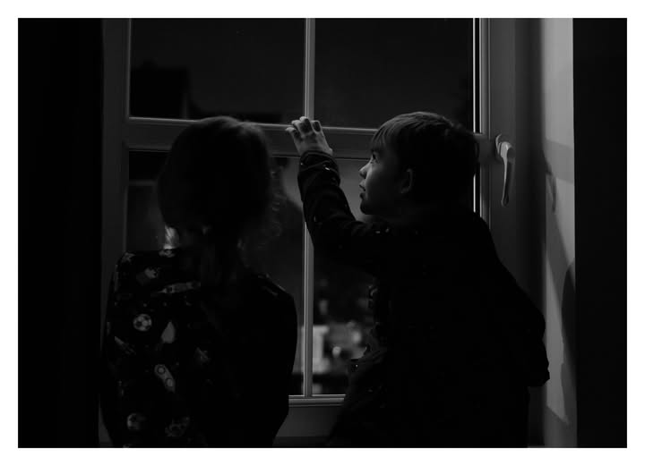 May be a black-and-white image of child and text