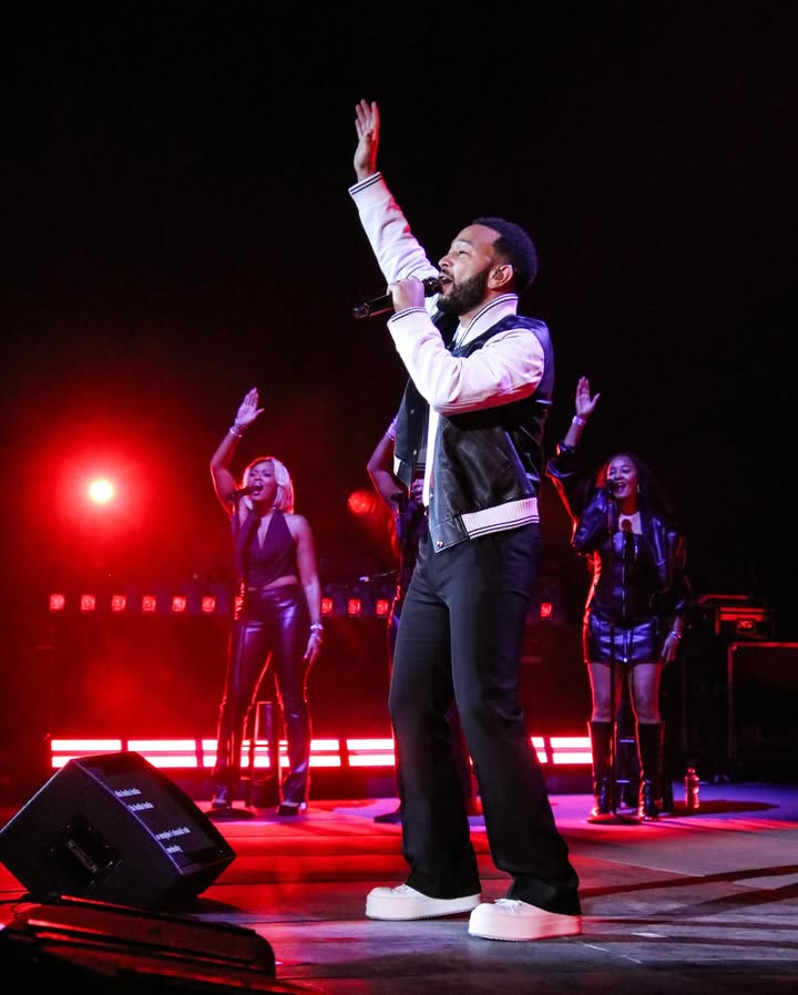 May be an image of microphone and concert