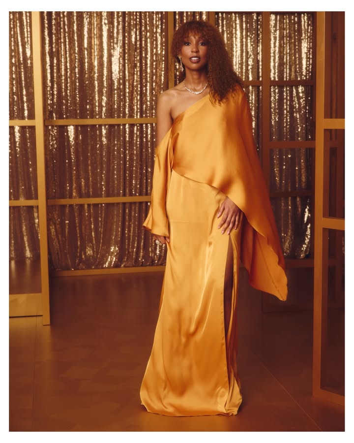 May be an image of dress and text