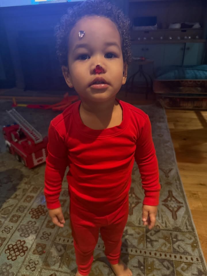 May be an image of baby, sleepwear, snowsuit, bandage, sweatsuit and text