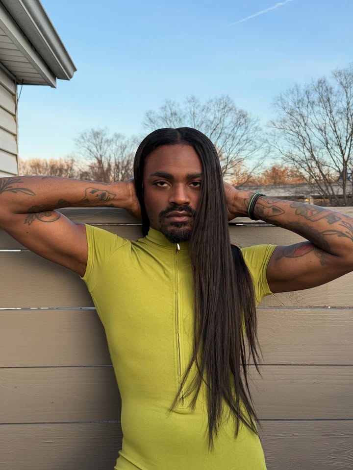 May be an image of turtleneck and text