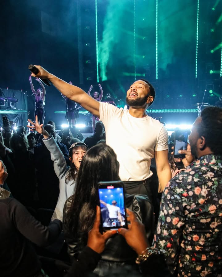 May be an image of one or more people, people standing, crowd, concert and text