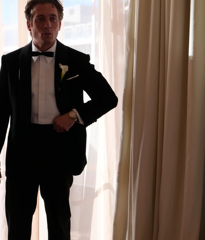 May be an image of one or more people, dinner jacket, suit, wedding and text