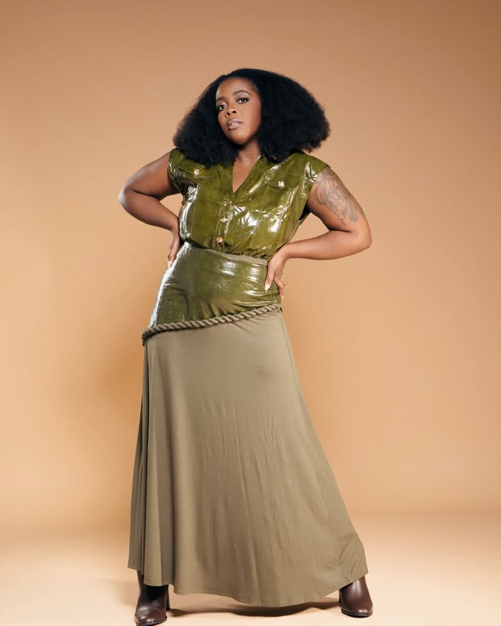 May be an image of leather, skirt, dress and text