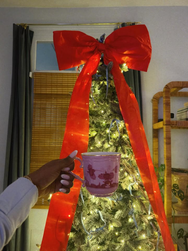 May be an image of christmas tree, coffee cup, tinsel, cup, tea and text