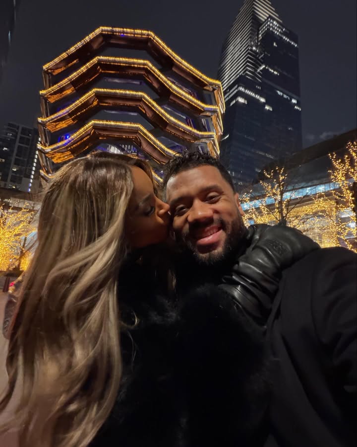 May be an image of people kissing and text