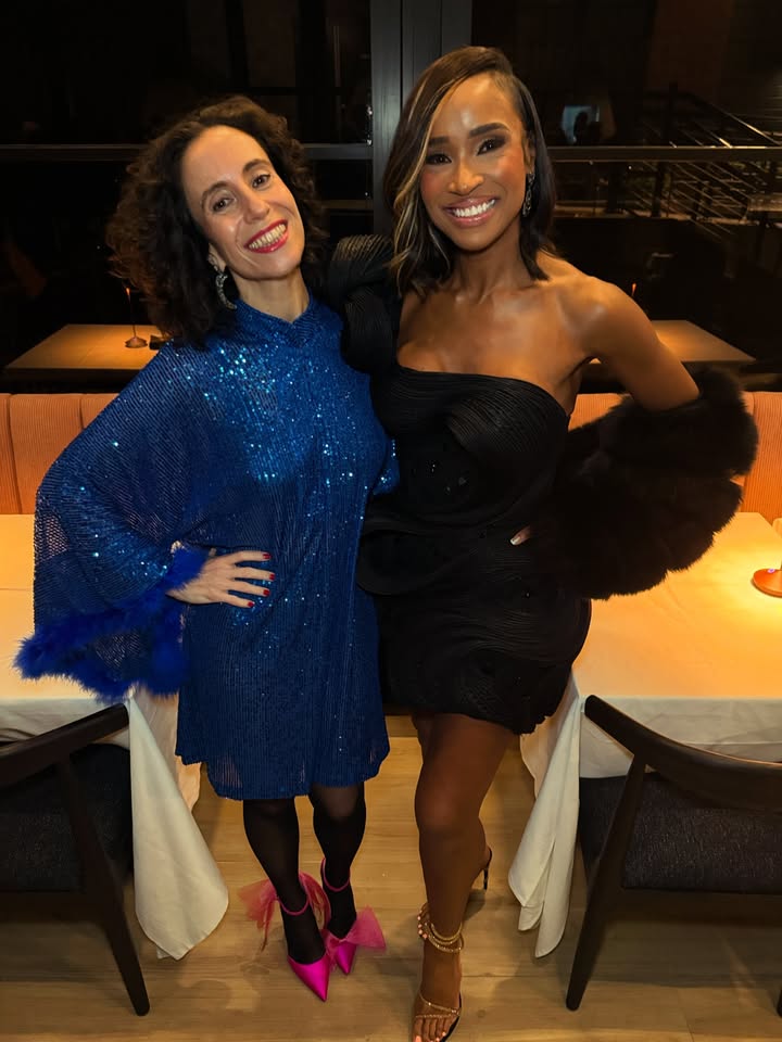 May be an image of one or more people, dress and text