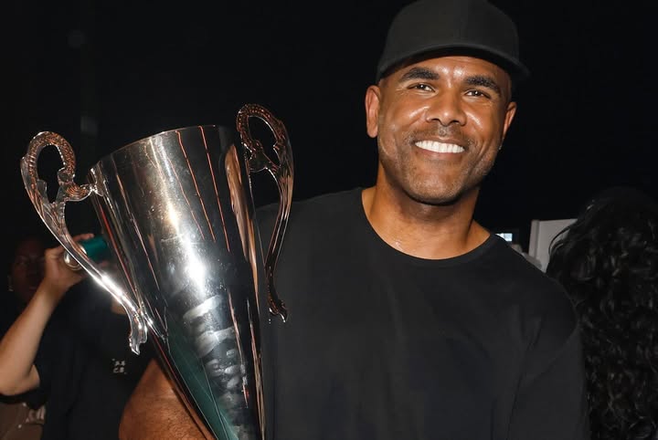 May be an image of one or more people and text