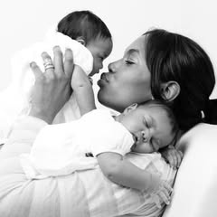 May be a black-and-white image of baby, people kissing and text