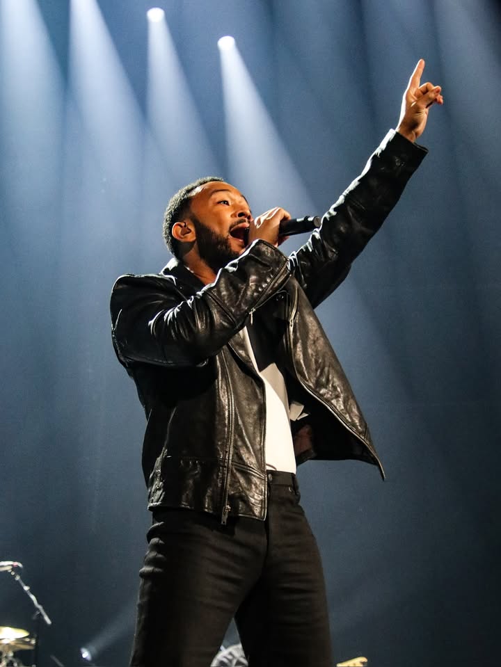 May be an image of microphone, concert and text