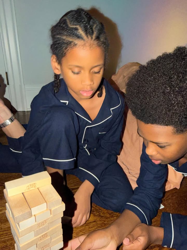 May be an image of sleepwear, scrabble, bath robe and text