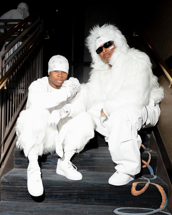 May be an image of fur coat, goosedown coat, sweatsuit, snowsuit, glasses and text