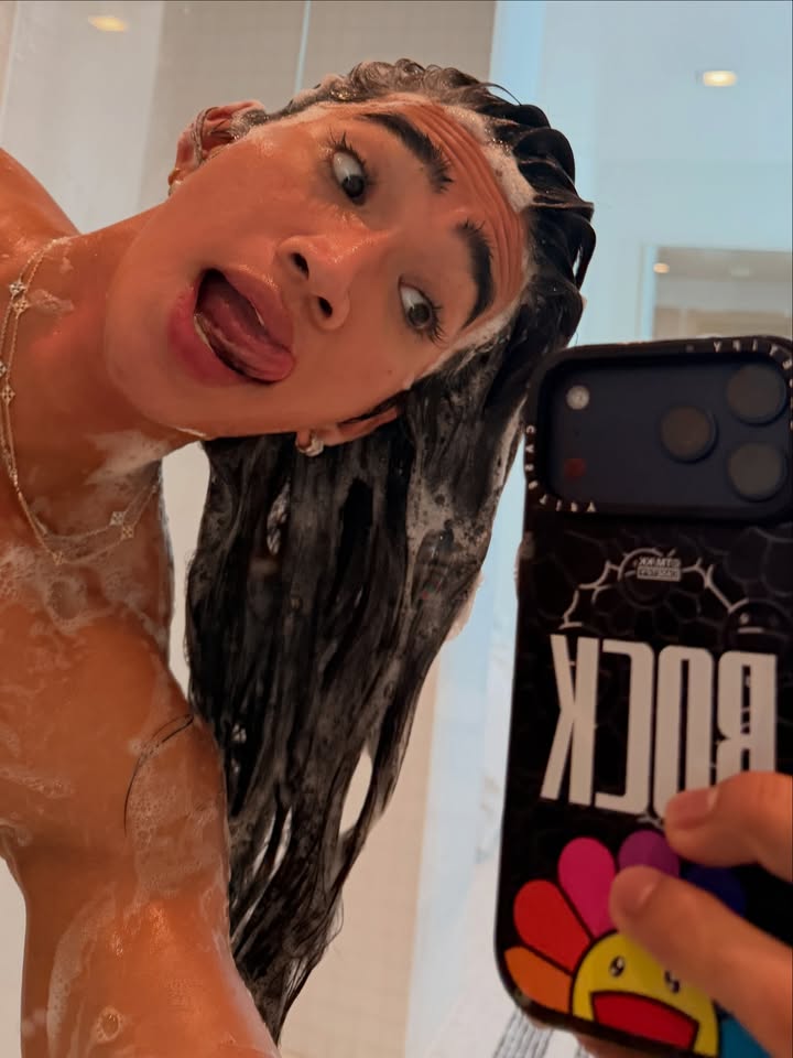 May be a selfie of one or more people, hair, phone, shower, bathtub and text