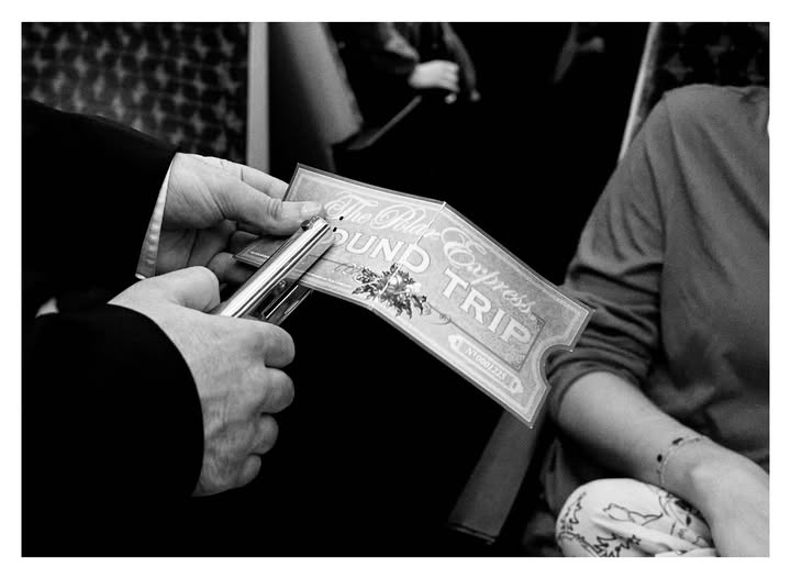 May be a black-and-white image of one or more people, turnstile, newspaper and text