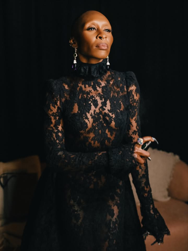 May be an image of one or more people, makeup, dress, gown and text