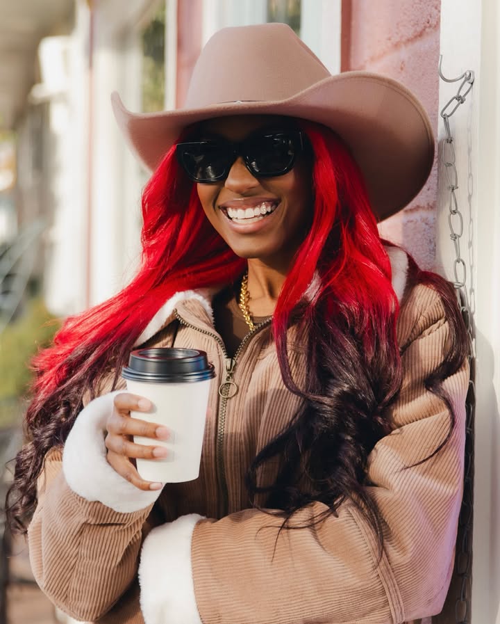 May be an image of one or more people, people smiling, hat, eyewear, beret and text