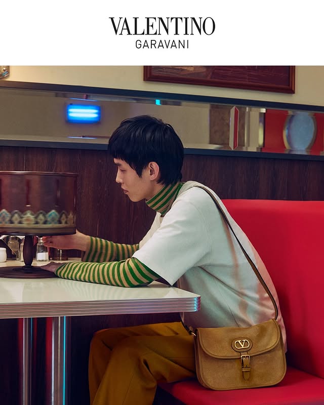 May be an image of top, magazine, poster and text