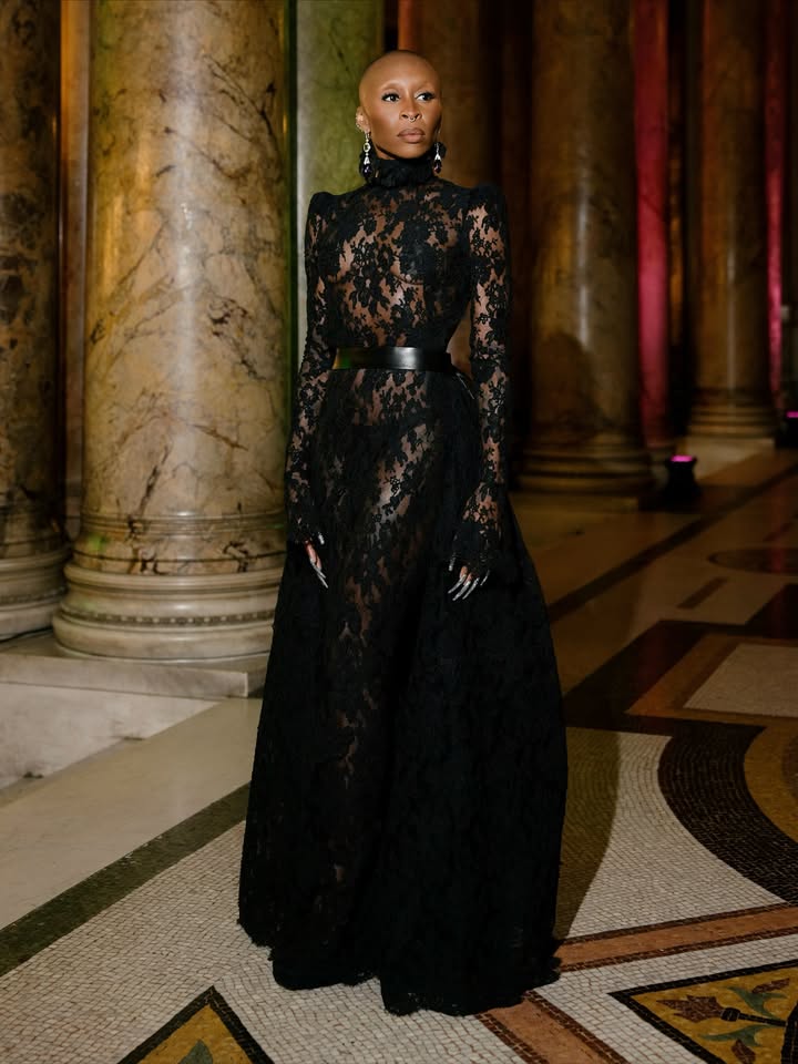 May be an image of one or more people, makeup, gown, dress and text