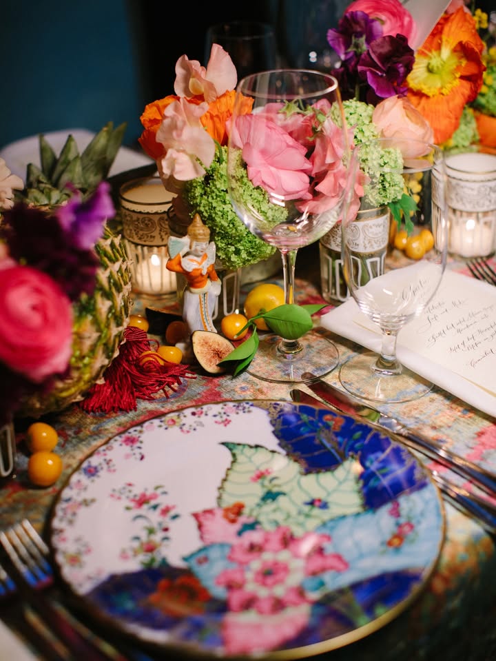 May be an image of candle holder, napkin ring, tablecloth, chinaware, flower arrangement and text