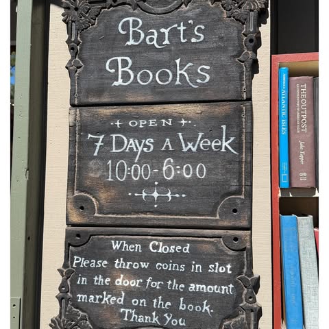 May be an image of book, signboard and text