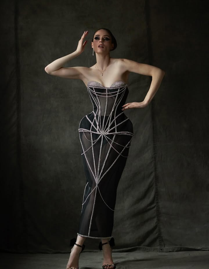 May be an image of dress, gown and text