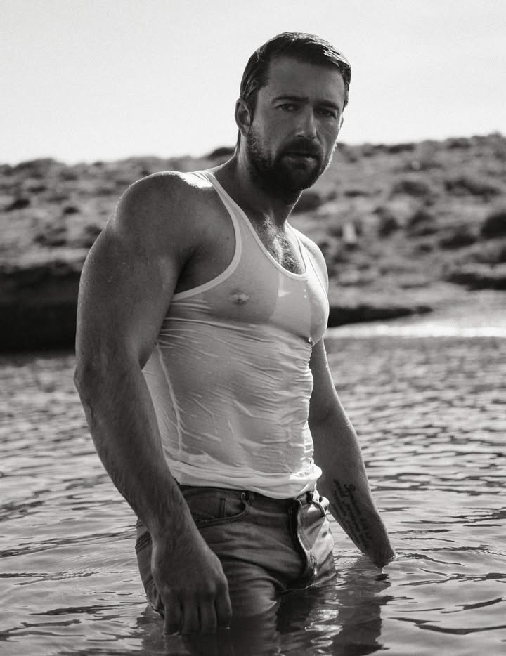 May be a black-and-white image of one or more people, beard, biceps and text