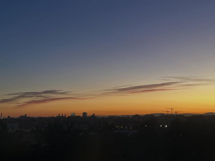 May be an image of cloud, horizon, twilight, fog and text