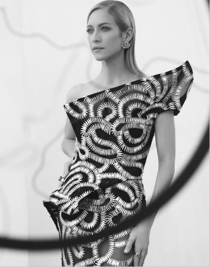 May be a black-and-white image of dress, overskirt and text