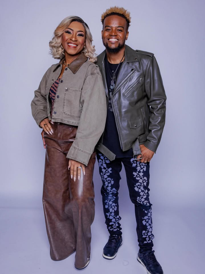 May be an image of one or more people, people smiling, blazer, jacket and text