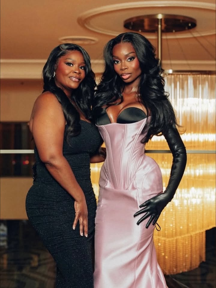 May be an image of one or more people, gown and text