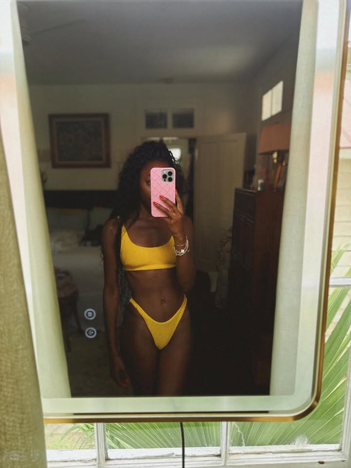 May be an image of halter top and text