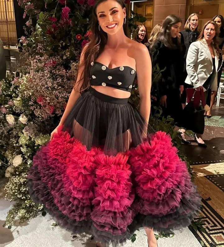 May be an image of one or more people, makeup, dress, skirt and text