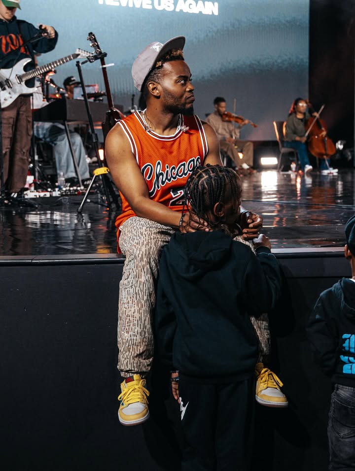 May be an image of child, crowd, concert and text