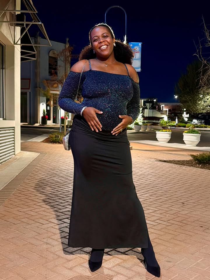 May be an image of one or more people, dress and text