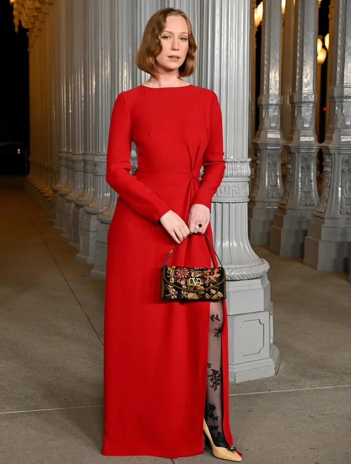 May be an image of gown, dress and text