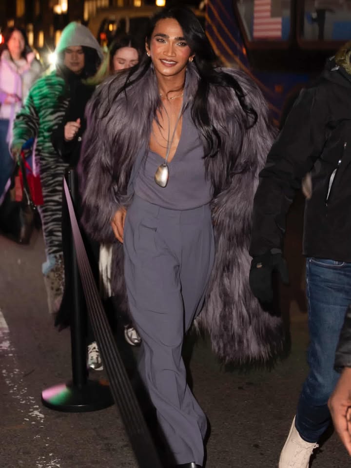 May be an image of one or more people, makeup, fur coat and text