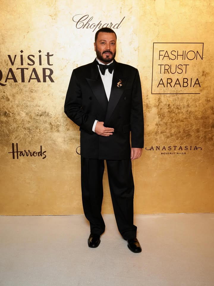 May be an image of dinner jacket, carpet and text that says 'Chopard visit ATAR FASHION TRUST ARABIA Harrods ANASTASIA DEVERLY EVERLYHILLS ILL HILLS'