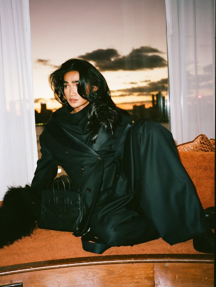 May be an image of one or more people, makeup, overcoat, duffle coat, fur, turtleneck, parka and text