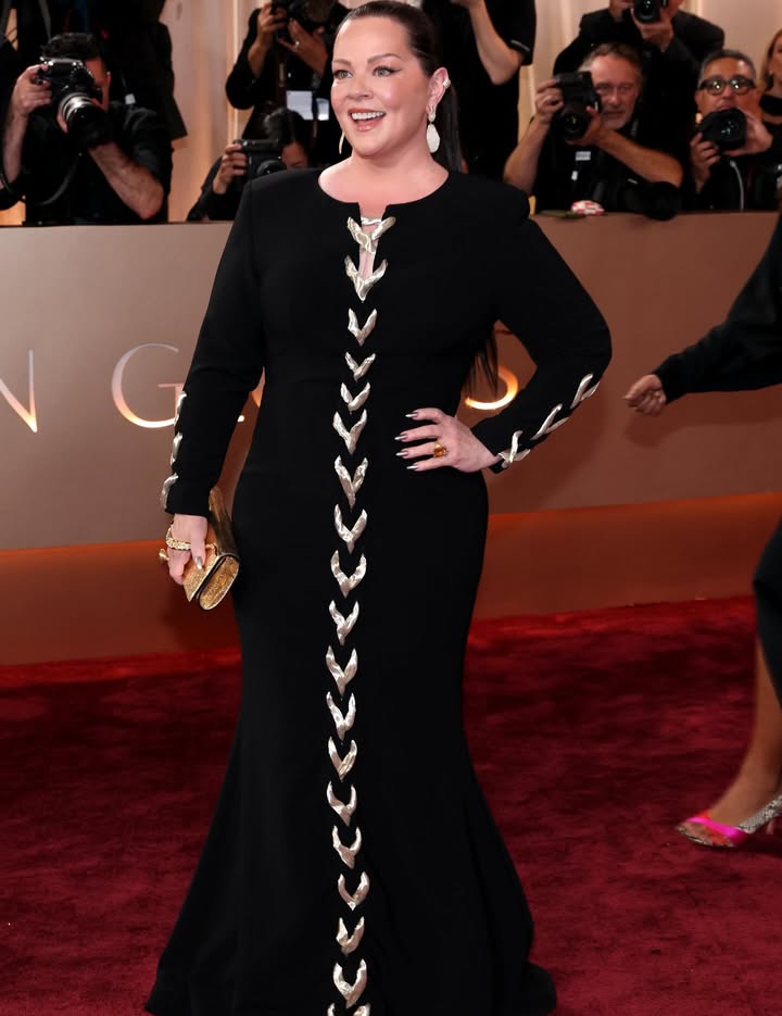 May be an image of gown, dress, carpet and text