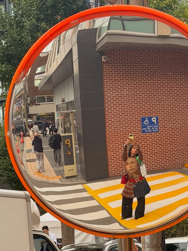 May be an image of mirror, tambourine and manhole