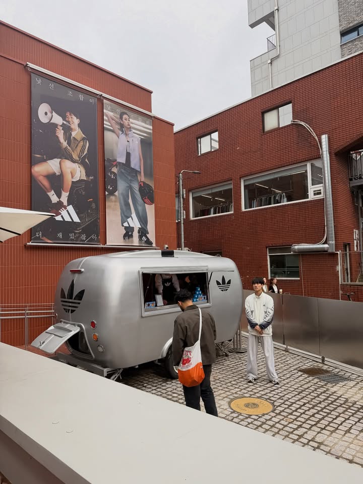 May be an image of bus and trailer