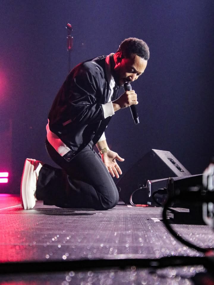 May be an image of microphone, concert and text