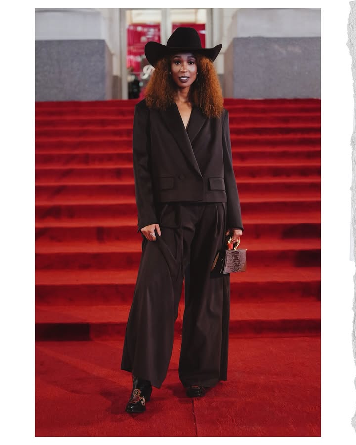 May be an image of one or more people, makeup, suit and text