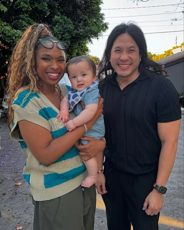 May be an image of baby, smiling, standing and text