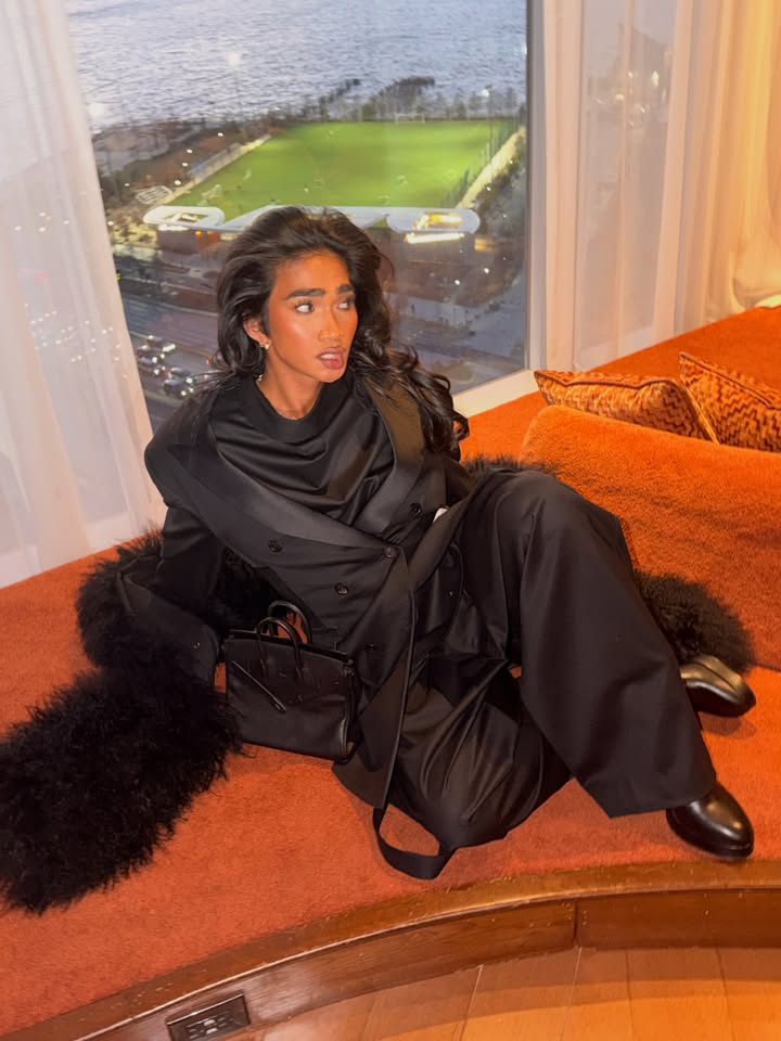 May be an image of one or more people, makeup, sable coat and text